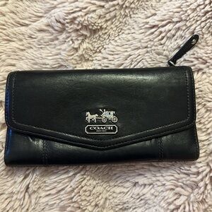 Gently used leather coach wallet.